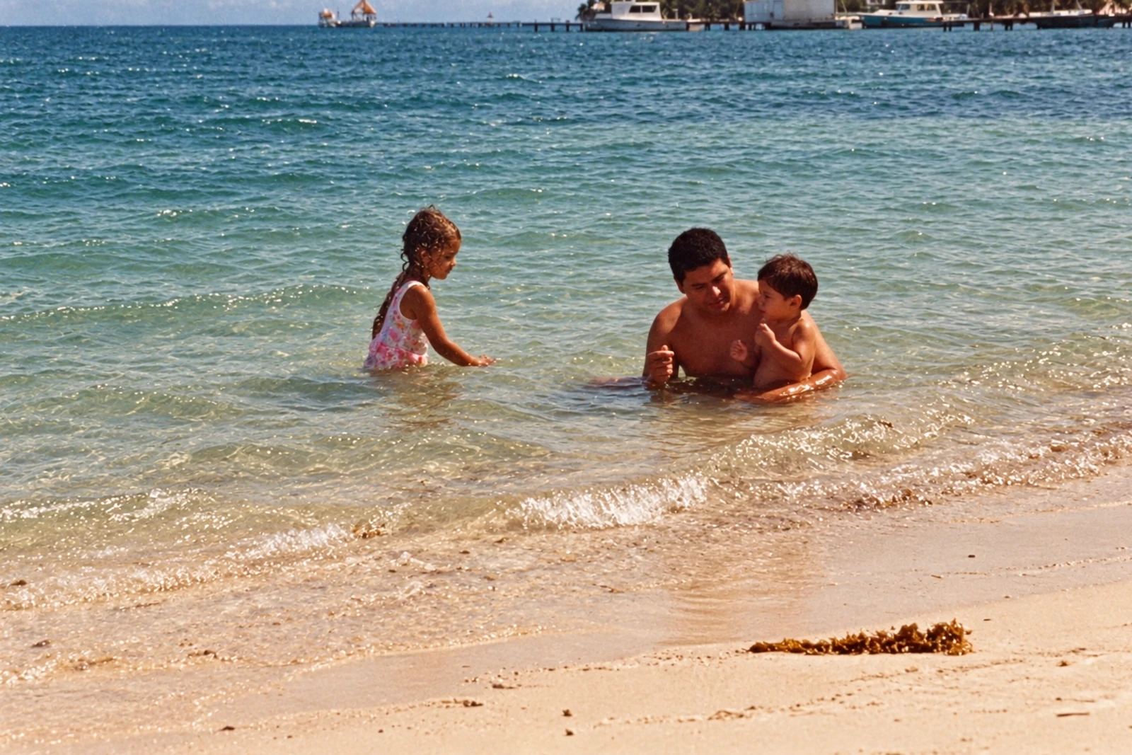 Dora and Felipe at the beach in San Pedro as children with their father