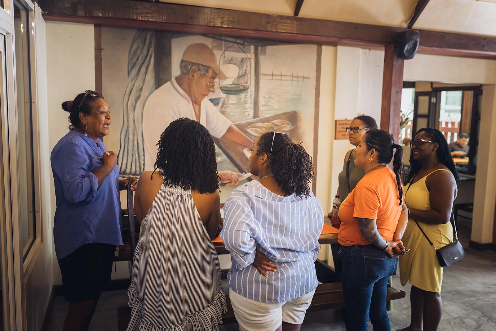 Guide sharing local stories with guests at El Fogon